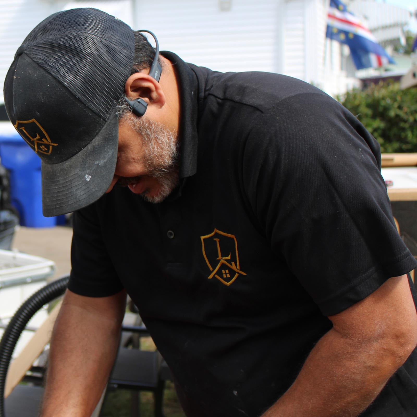 Legacy Tile craftsman at work, wearing the Legacy uniform